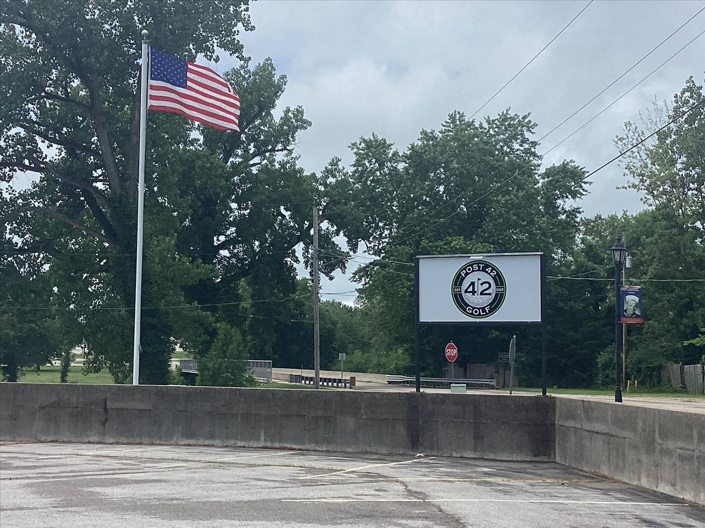 Post 42 Golf outdoor sign with American flag in Herculaneum Missouri